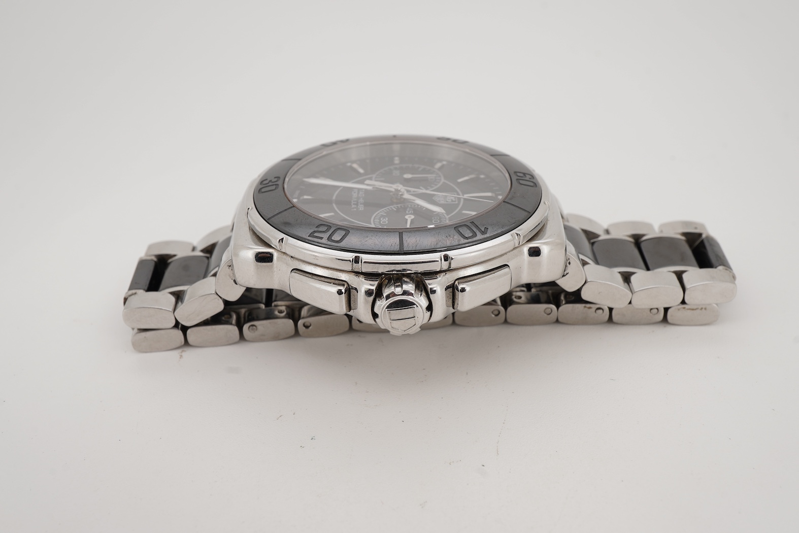 A gentleman's 2011 stainless steel TAG Heuer Formula One quartz chronograph wrist watch, on a stainless steel Tag Heuer bracelet